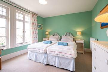 The third bedroom on the first floor with twin beds.