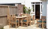 The inviting dining area to the garden is welcome spot to relax and plan your day. - Thumbnail Image