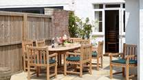 The inviting dining-area to the garden is a welcome spot to relax and plan your day.
