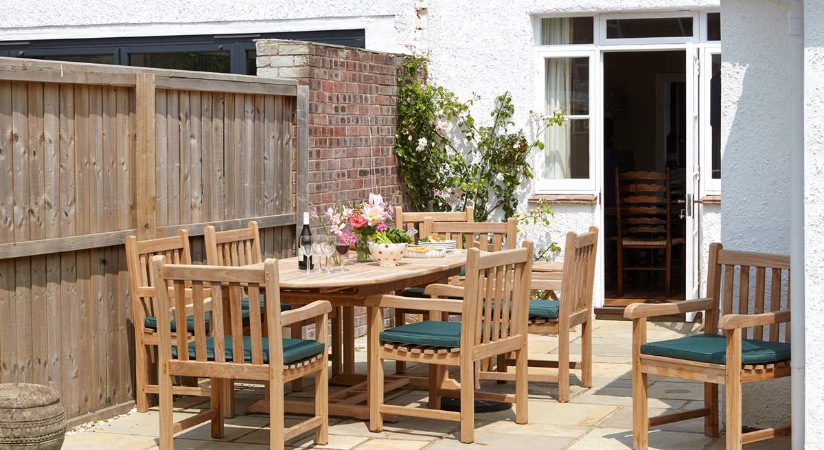 The inviting dining area to the garden is welcome spot to relax and plan your day.