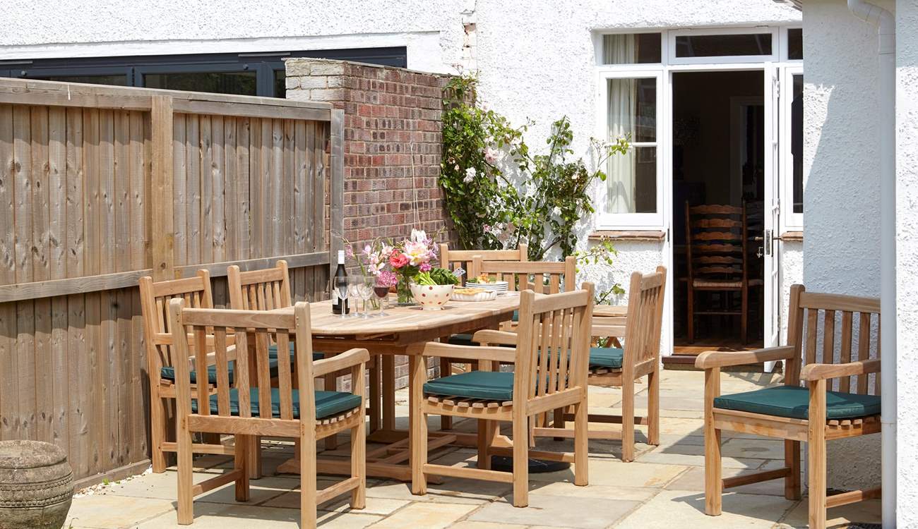 The inviting dining area to the garden is welcome spot to relax and plan your day.