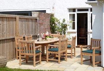 The inviting dining area to the garden is welcome spot to relax and plan your day.