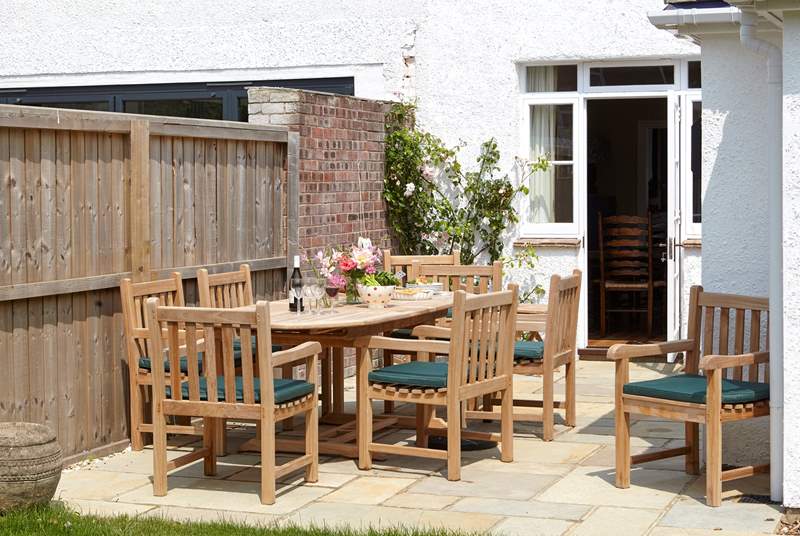 The inviting dining area to the garden is welcome spot to relax and plan your day.