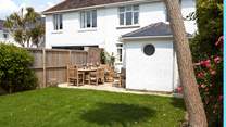 The rear garden is a sun-trap and safe for the children to run around in.