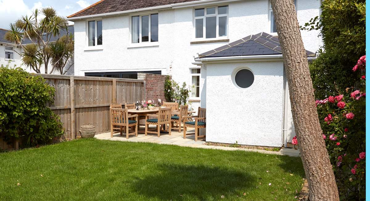 The rear garden is a sun-trap and safe for the children to run around in.