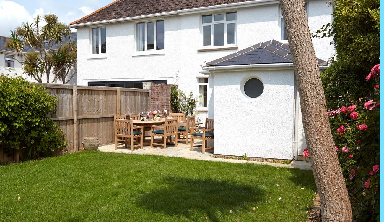 The rear garden is a sun-trap and safe for the children to run around in.