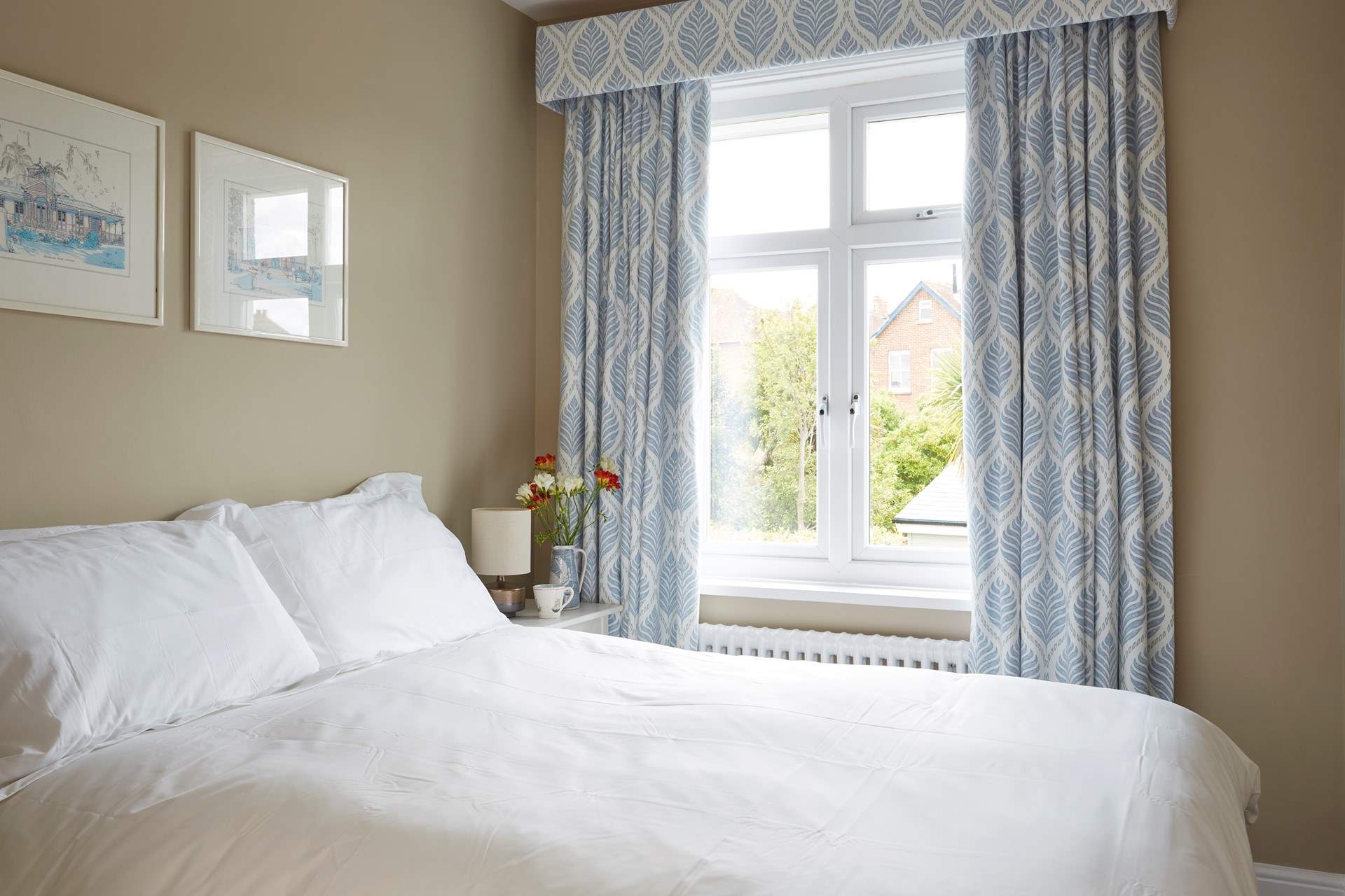 The second bedroom with a double bed facing the back garden.