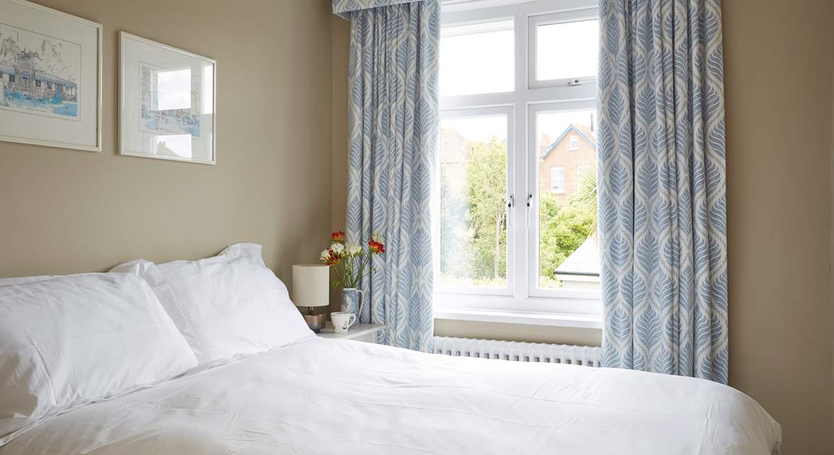 The second bedroom with a double bed facing the back garden.