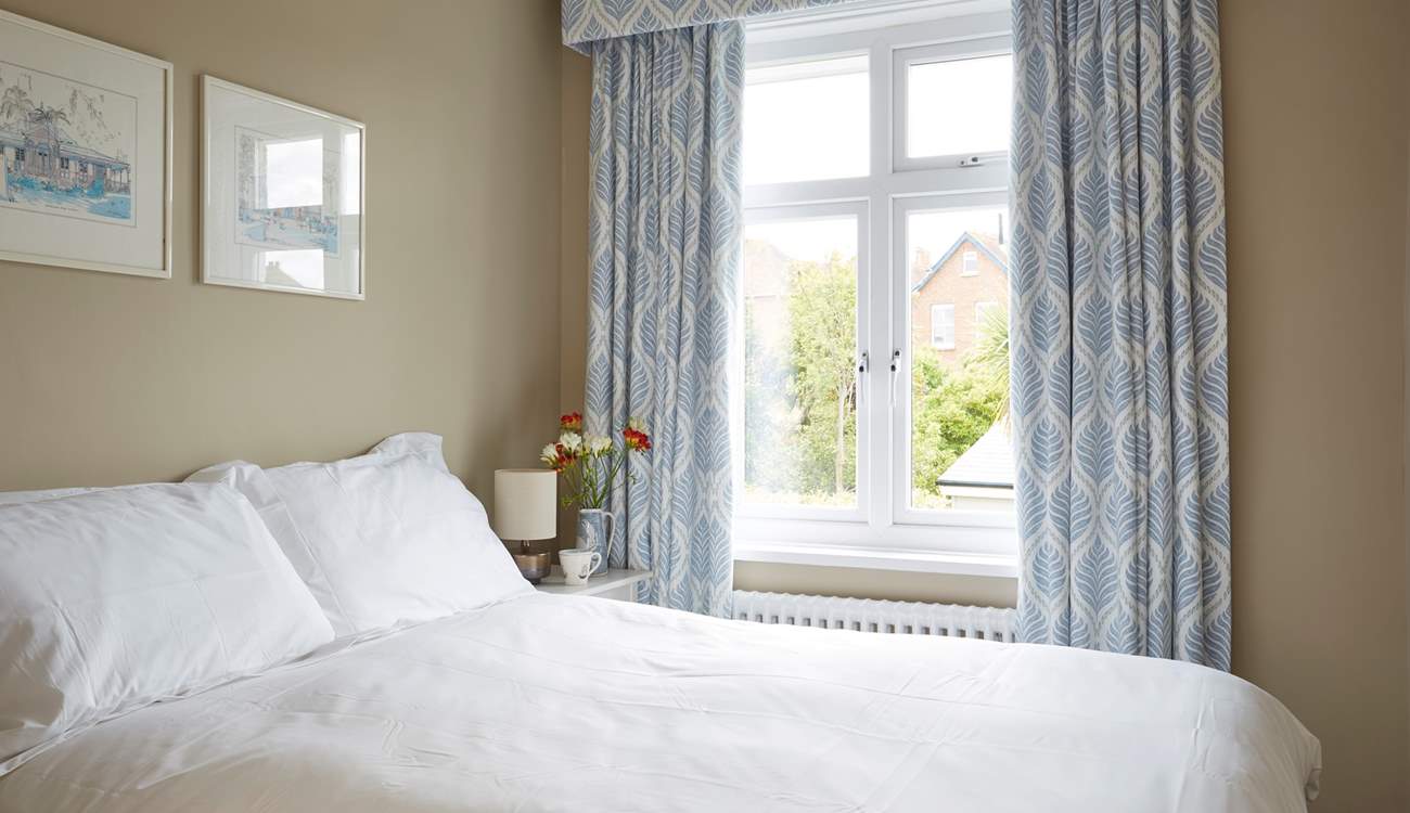 The second bedroom with a double bed facing the back garden.