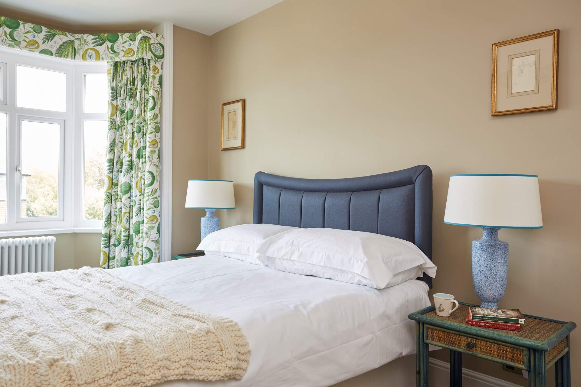 The master bedroom with king-size double bed facing the front of the house.