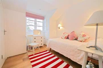 A room fit for a princess. The pretty single bedroom on the first floor.