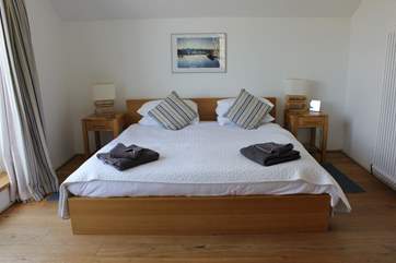 Rear bedroom with balcony.