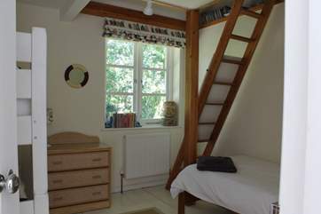 The family bedroom on the first floor. There is access to the playroom from this room by steep ladder stairs (kept locked to restrict accessed but can be unlocked if considered safe for older children).