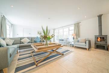 The spacious sitting/dining-room is beautifully decorated and a perfect place for all the family to relax.