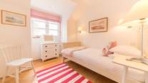 The pretty fifth bedroom located on the first floor.