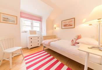 The pretty fifth bedroom located on the first floor.