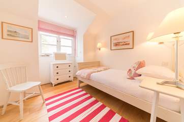 The pretty fifth bedroom located on the first floor.