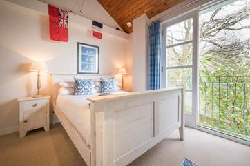 Enjoy the breeze from the Juliet balcony in the fourth bedroom...
