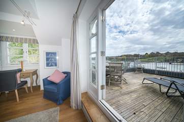 Wake up to the sunrise right from your bed in the main bedroom.
