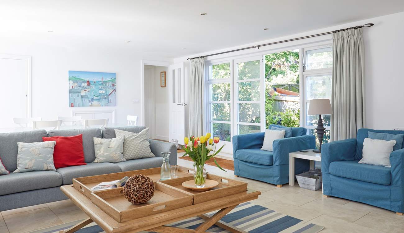 The spacious sitting/dining-room is beautifully decorated and a perfect place for all the family to relax. 