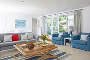 The spacious sitting/dining-room is beautifully decorated and a perfect place for all the family to relax.