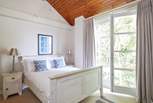 Enjoy the breeze from the Juliet balcony in the fourth bedroom...
