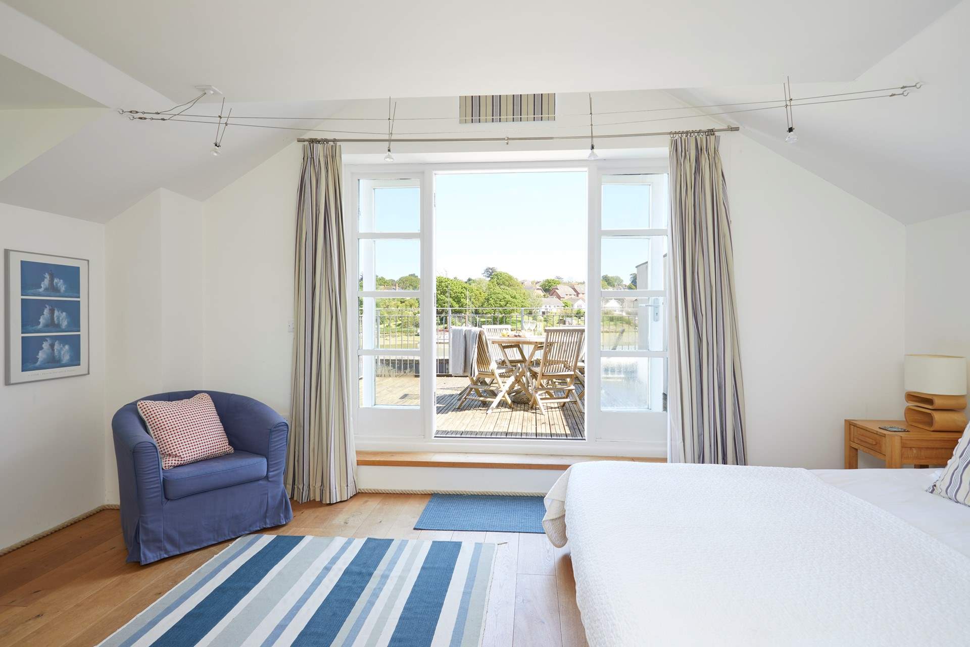 The lovely first floor main bedroom with its private balcony.