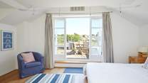 The lovely first floor main bedroom with its private balcony.