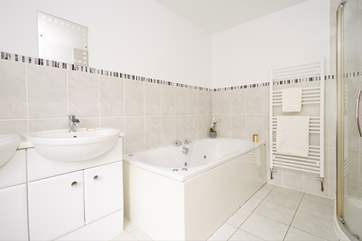 The en suite bathroom with shower, WC and double hand basins.