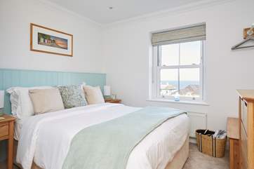 The king size bed in one of the double bedrooms at Cromwell Apartment.