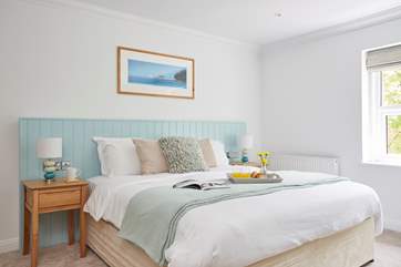 The family bedroom with a super king size bed, bunk beds for the little ones and an en suite bathroom with shower, WC and double hand basins.