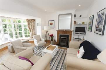 Rest up in the cosy sitting-room with plenty of seating for all.