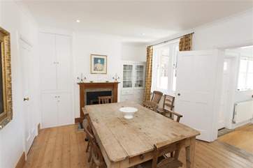 This wonderful wooden table, seating 8, is perfect for family meals.