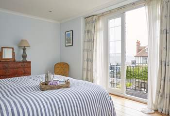 The main bedroom on the first floor showcases stunning sea views. 