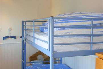 The bunk bedroom is suitable for children or adults.