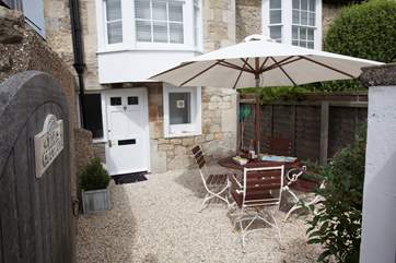 There is a small patio to the front of the property.