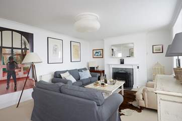 Read a book, watch TV, cleverly concealed behind the mirror panels over the fireplace and talk about your day in the cosy sitting-room.