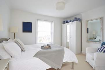 The superb master bedroom with comfy king-size bed.