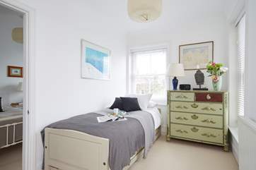 The pretty single bedroom leads into the twin bedroom.