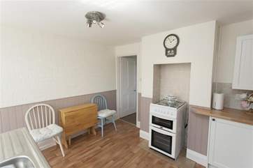 The drop-leaf dining table.