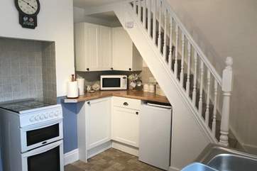 The compact kitchen/diner. Please note that the stairs are quite narrow.