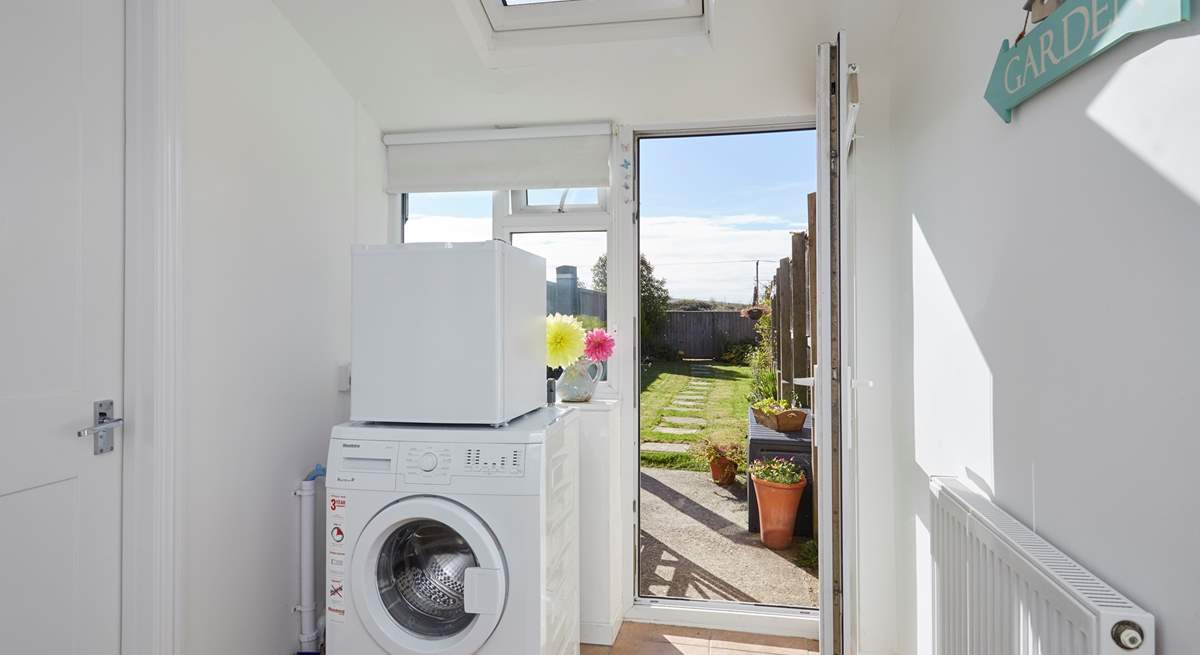 The handy utility-room leads out to the garden.