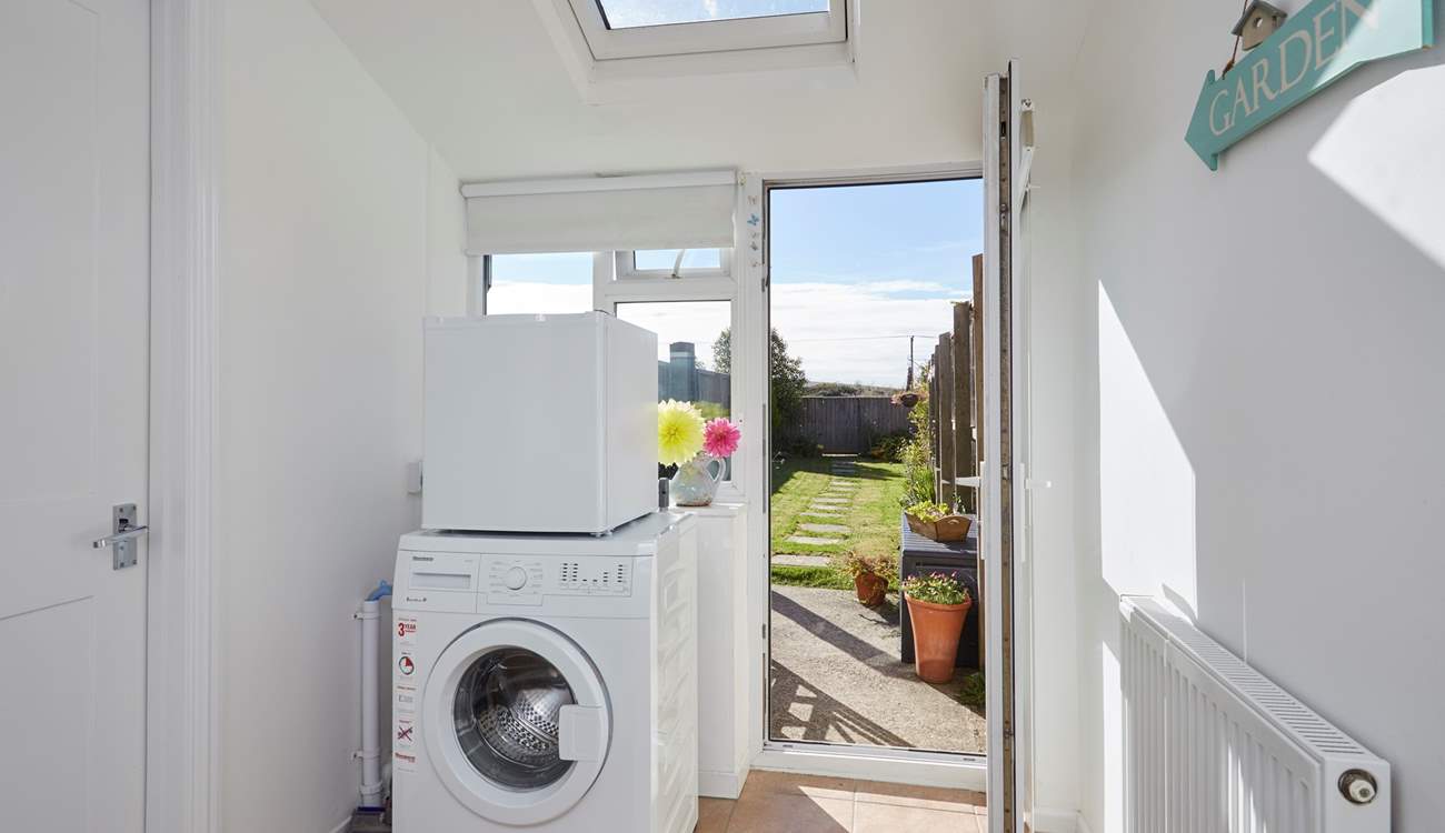 The handy utility-room leads out to the garden.