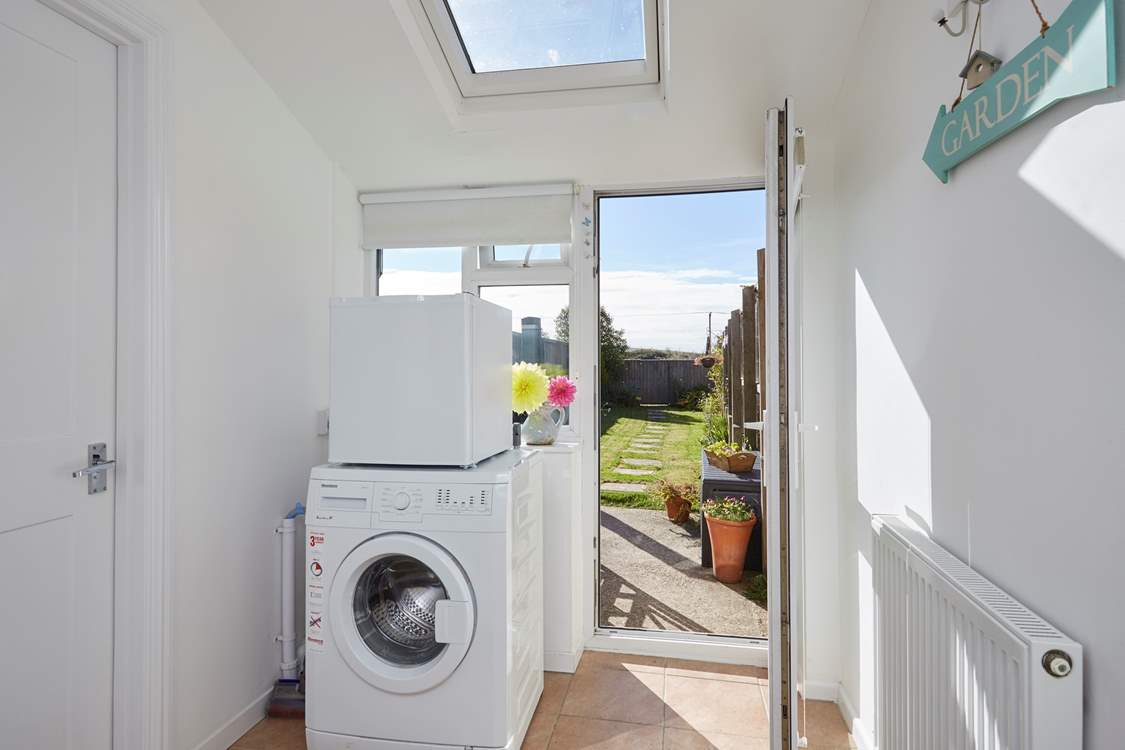 The handy utility-room leads out to the garden.