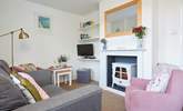 The cosy sitting-room is charming. - Thumbnail Image