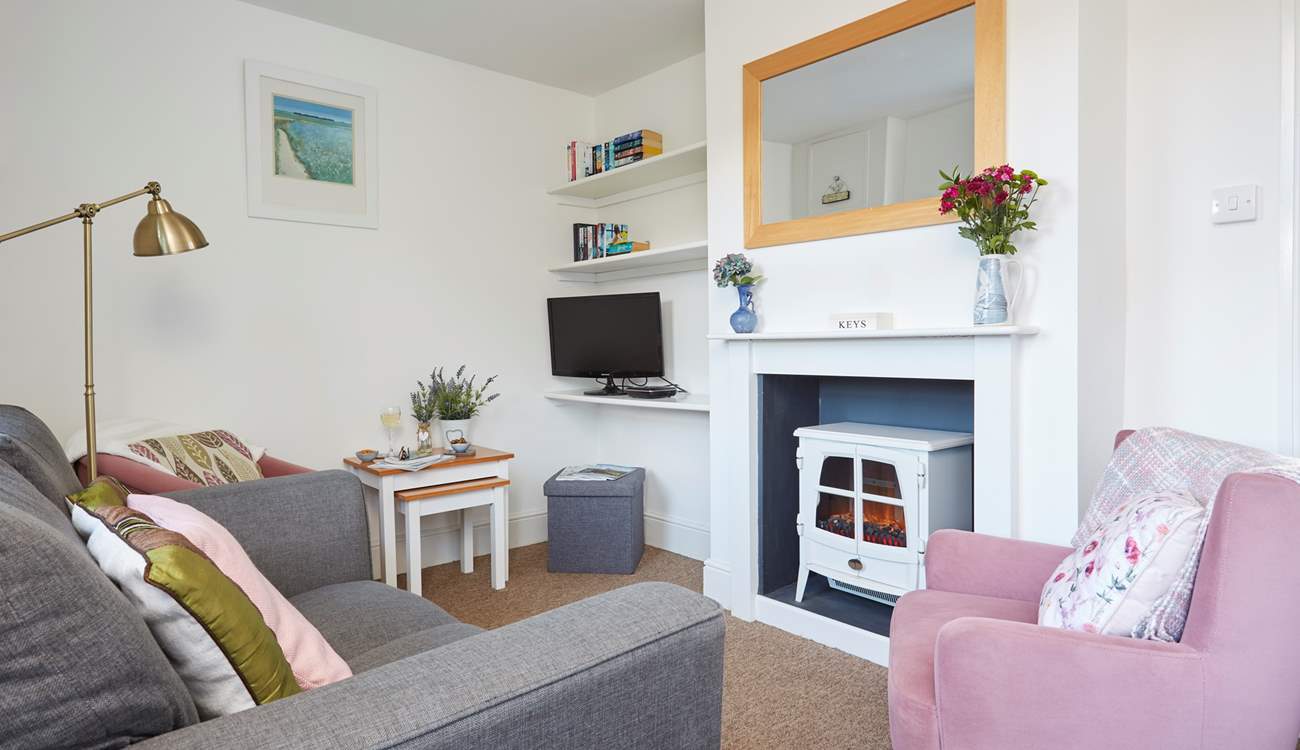 The cosy sitting-room is charming.