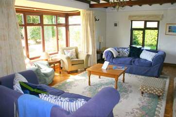 A lovely bright and spacious sitting-room, ideal for large families.