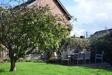 The patio at the front of Fernfield looks out to the rear garden area.