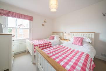The twin bedroom on the first floor with en suite WC and wash-basin.