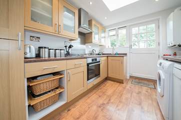 The well equipped kitchen has an Nespresso machine with a small selection of pods.